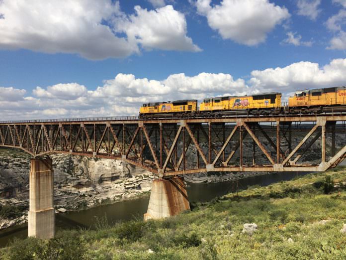 A Union Pacific locomotive crosses the Pecos River Bridge in Langtry, Texas. Credit: Union Pacific.