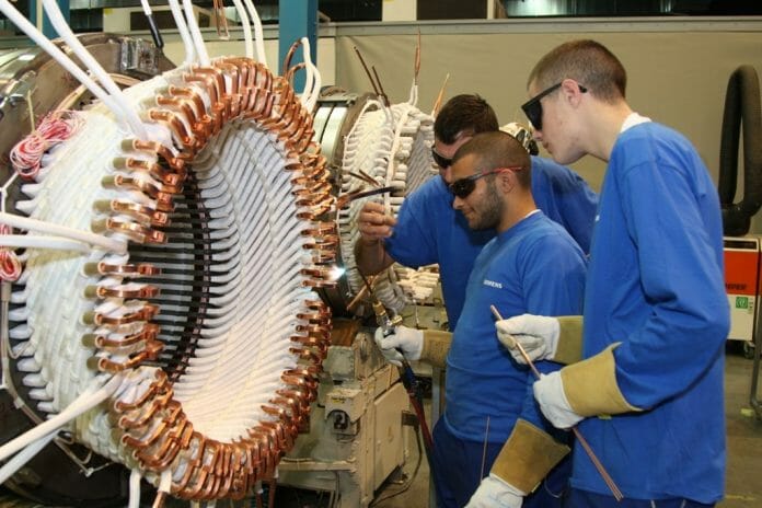 Students working at Siemens' Subotica factory. Photo: Siemens.
