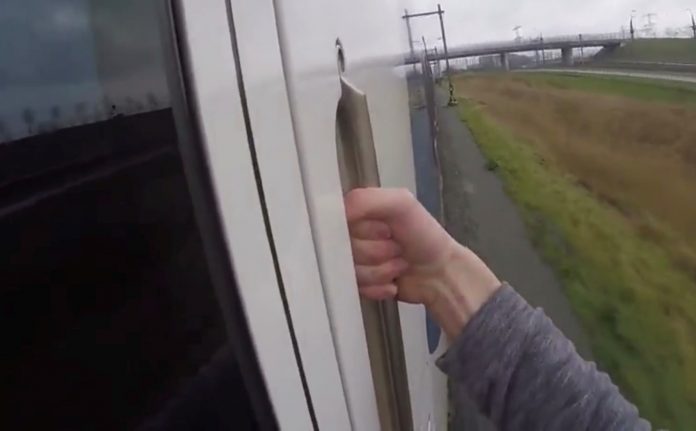 A still taken from a video of a train surfer. Photo: ProRail.